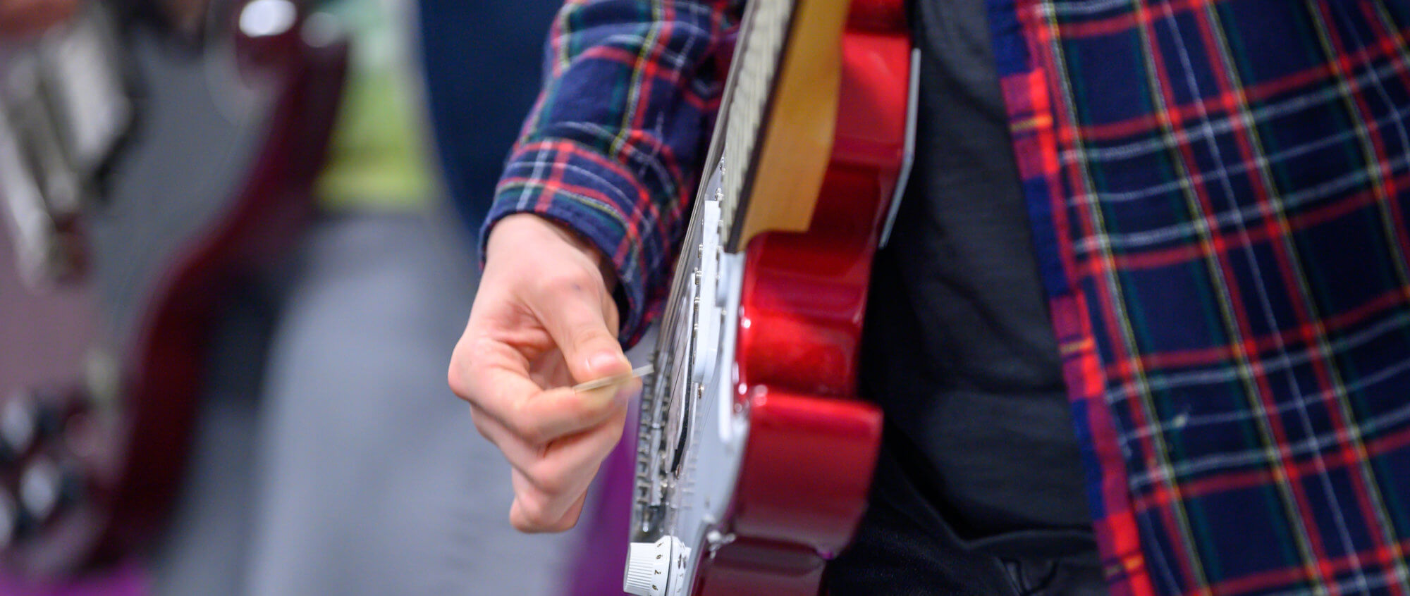 Person playing guitar, credit Nick Harrison
