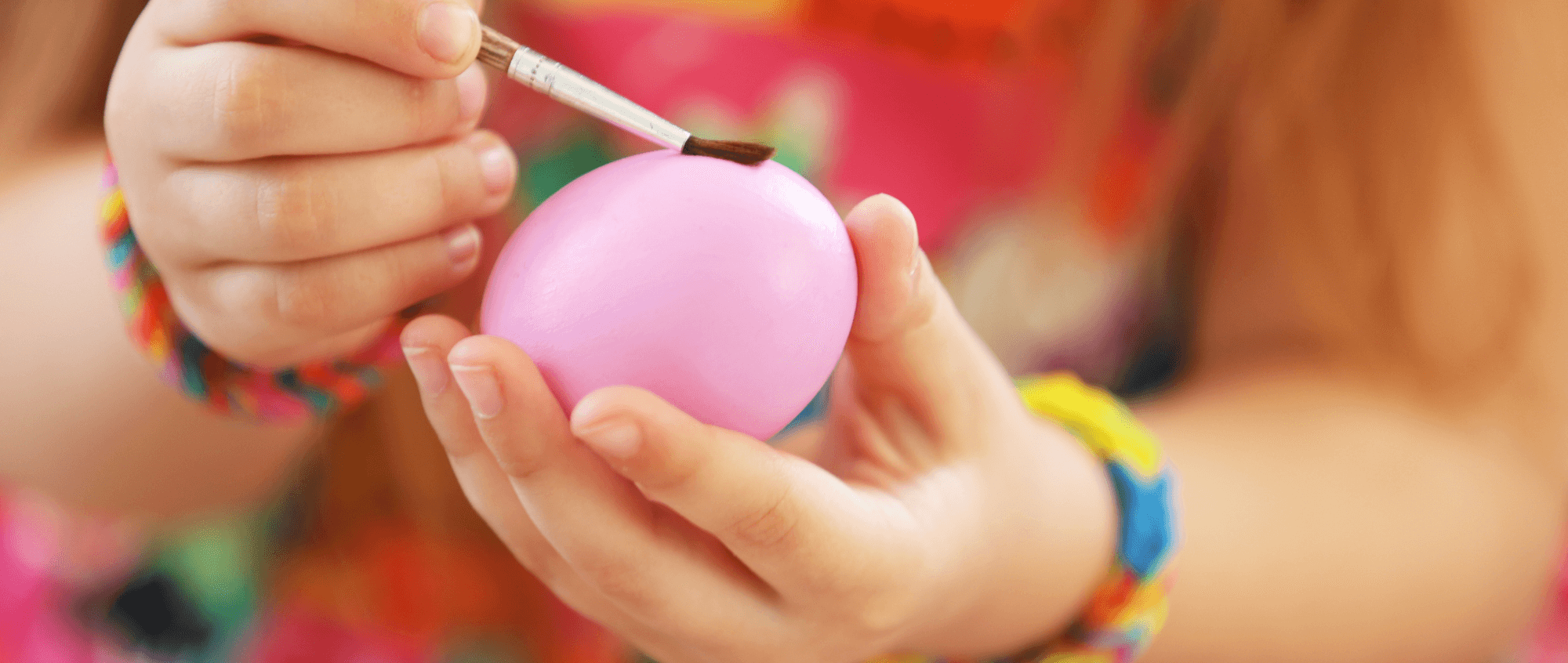 Child painting egg