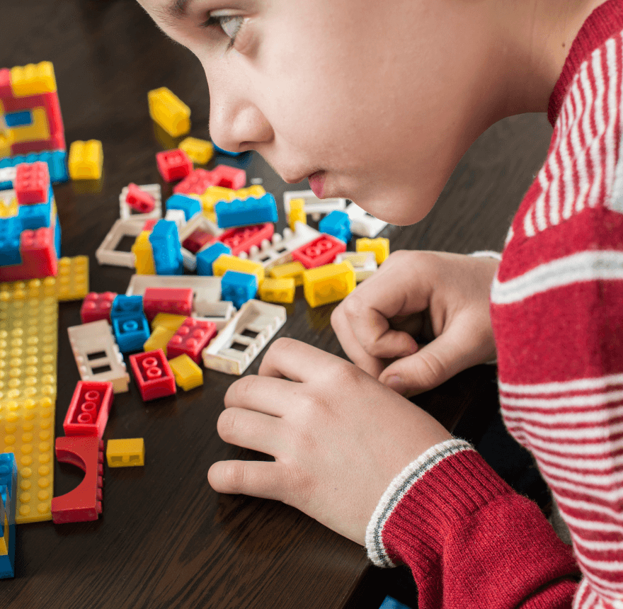 Child playing with lego