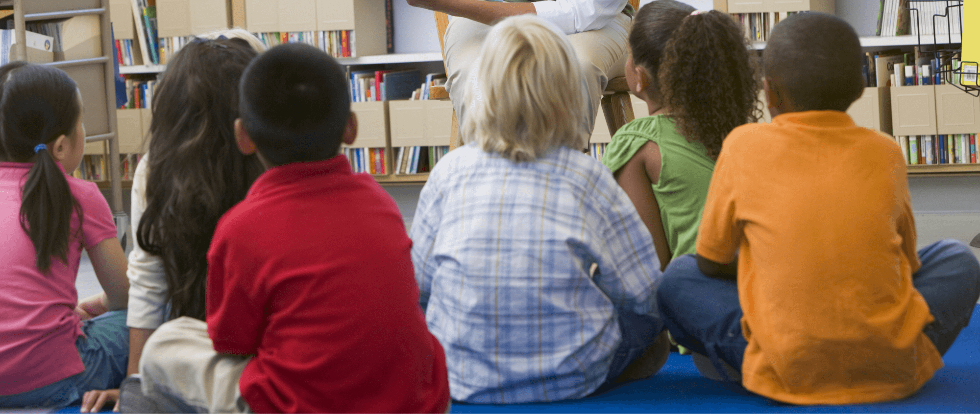 Children sitting on carpet