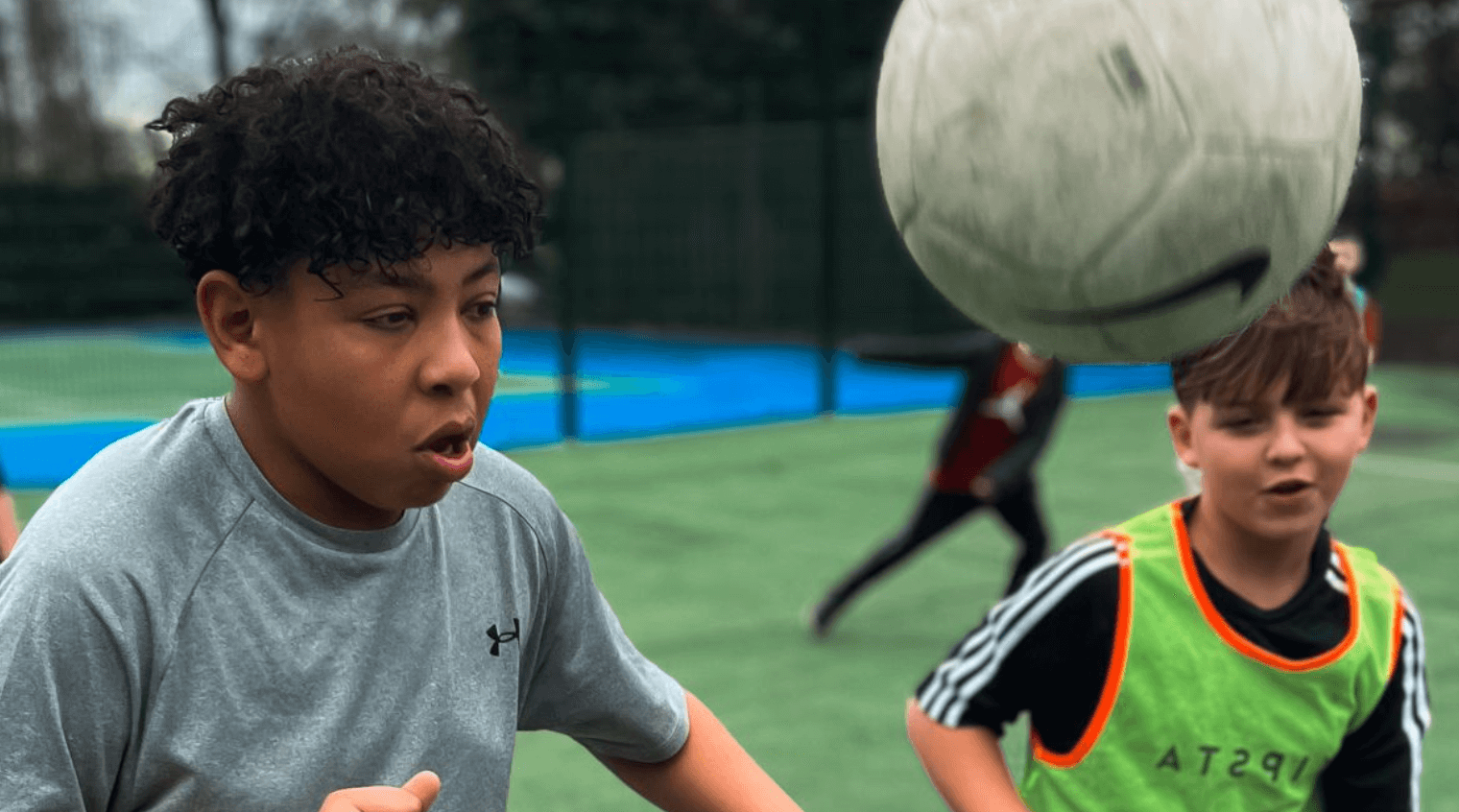 Young boys playing football