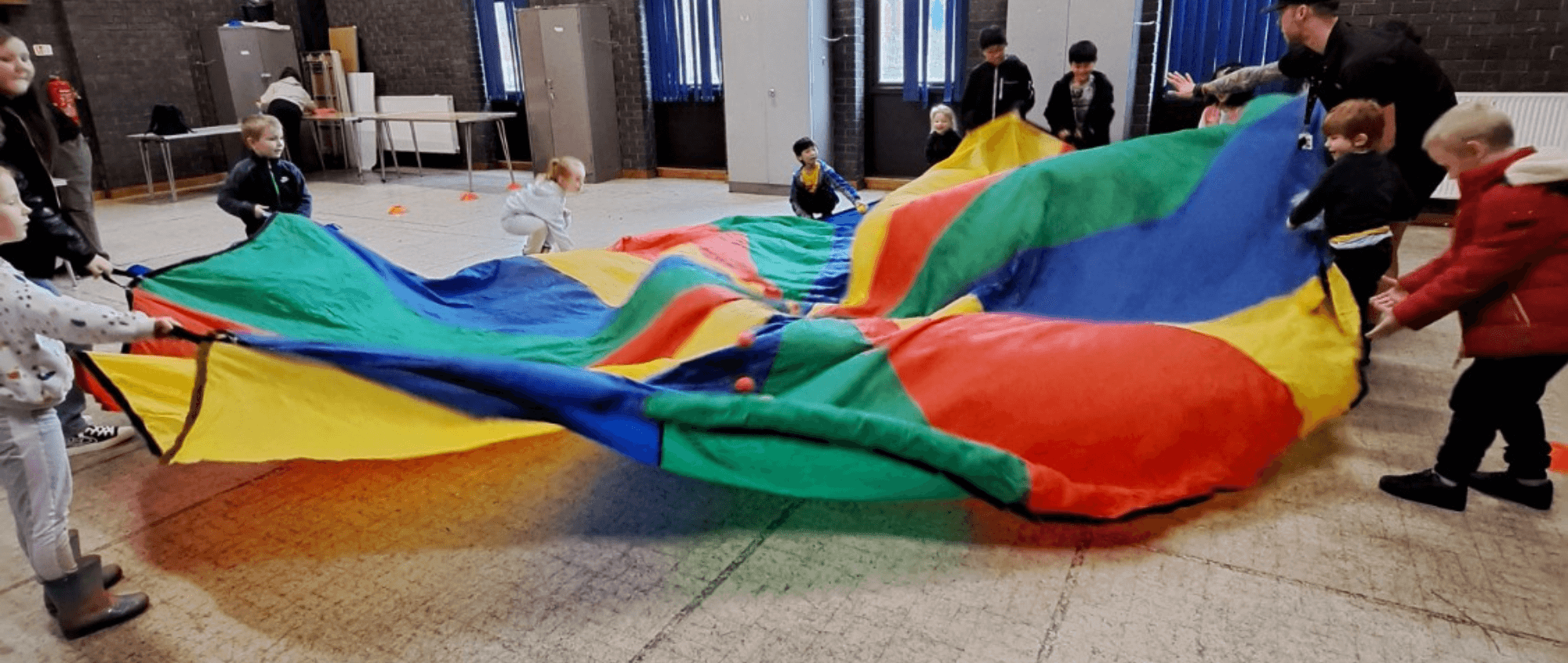 Children playing with a parachute
