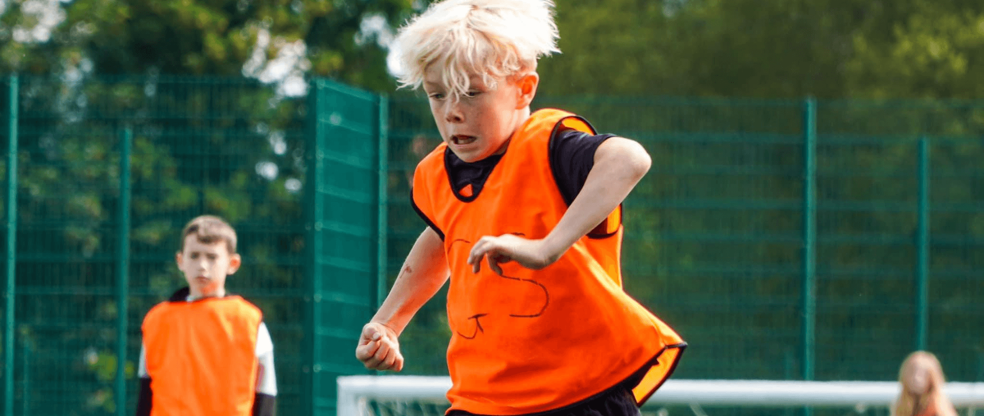 Child playing football