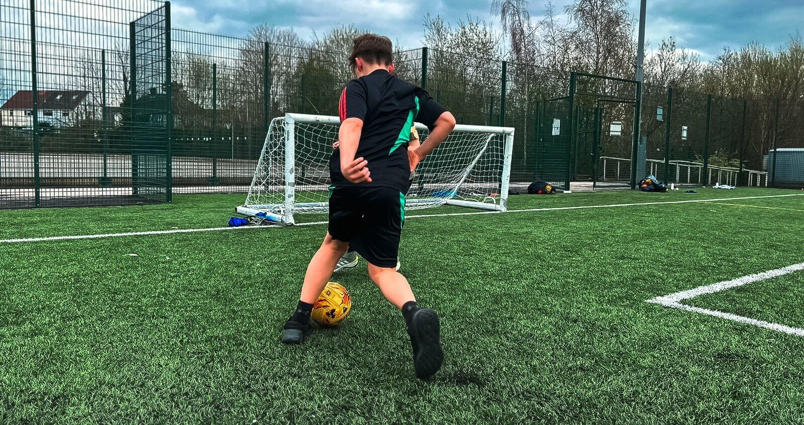 Child playing football
