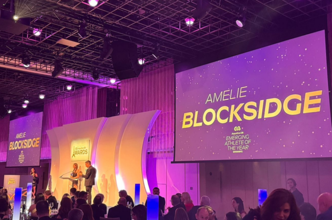 Amelie on a stage at awards