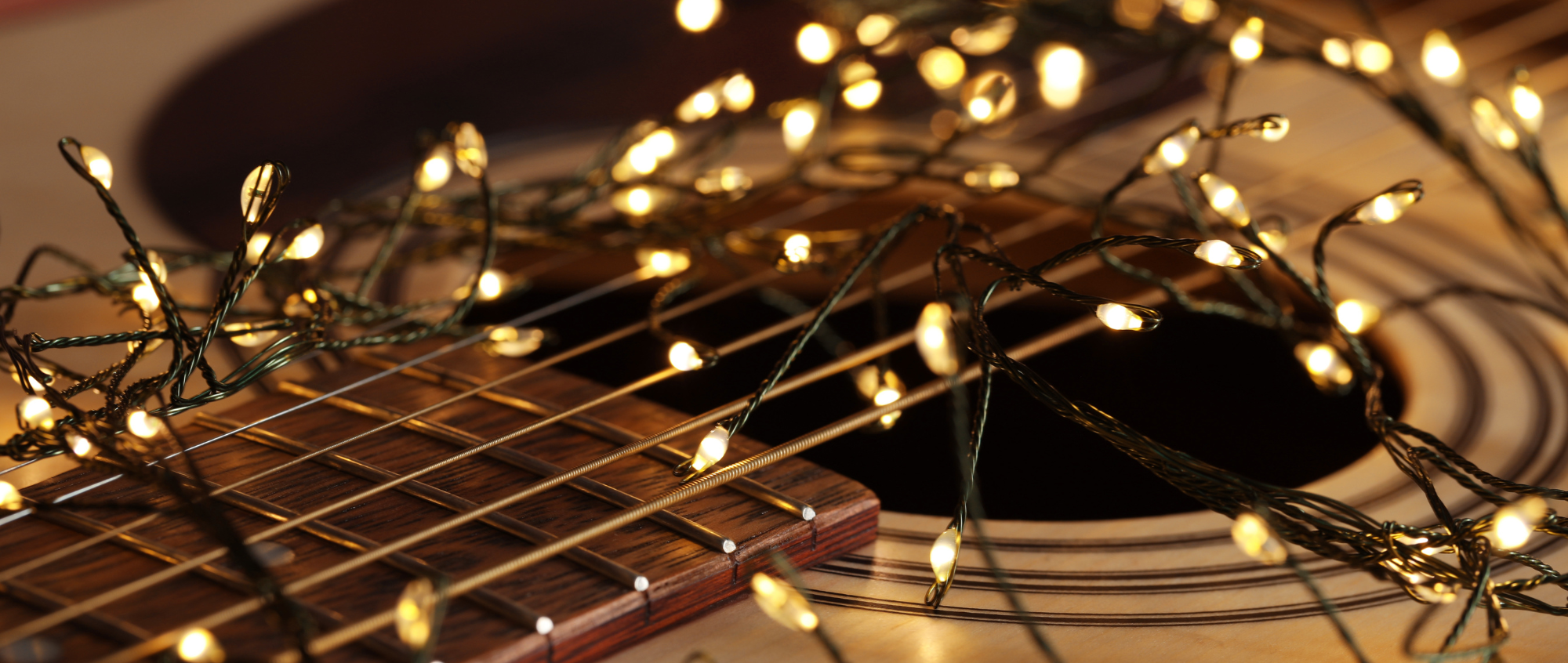 Guitar with gold festive lights