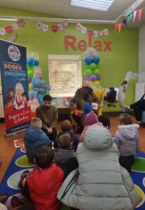 Simon Donn, Library Development Officer, leads a storytelling session with children from Little Hulton.