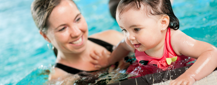 Woman and baby in pool