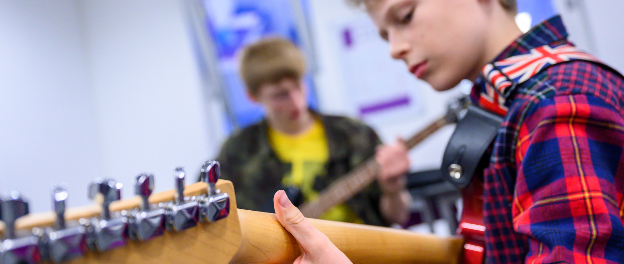 Young boys playing guitars