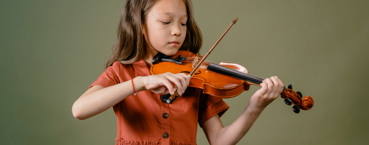 Young girl playing violin