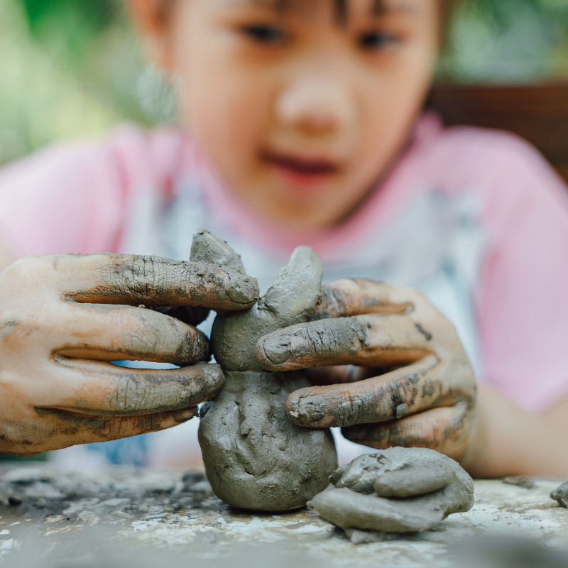 Child playing with clay