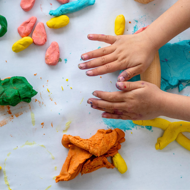 Child playing with clay