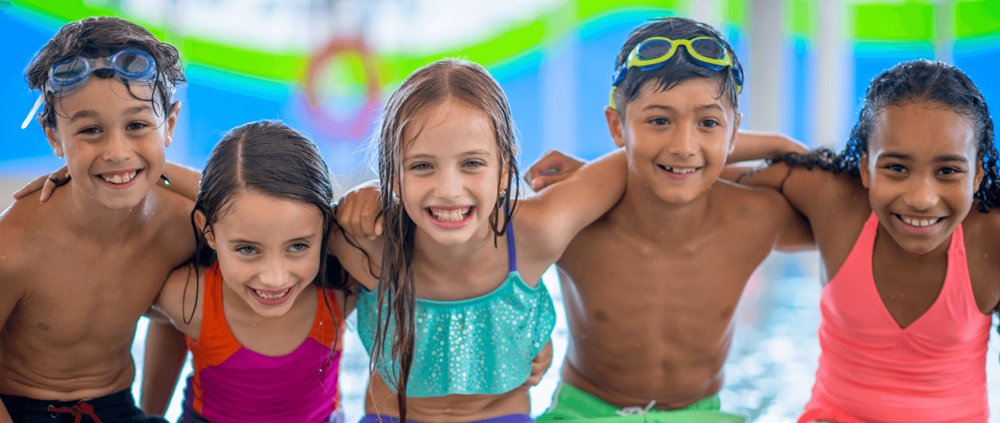 Children sat down next to pool