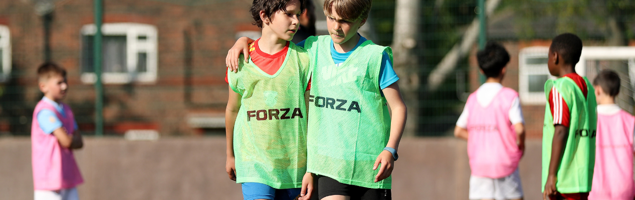 Boys with arms around each other