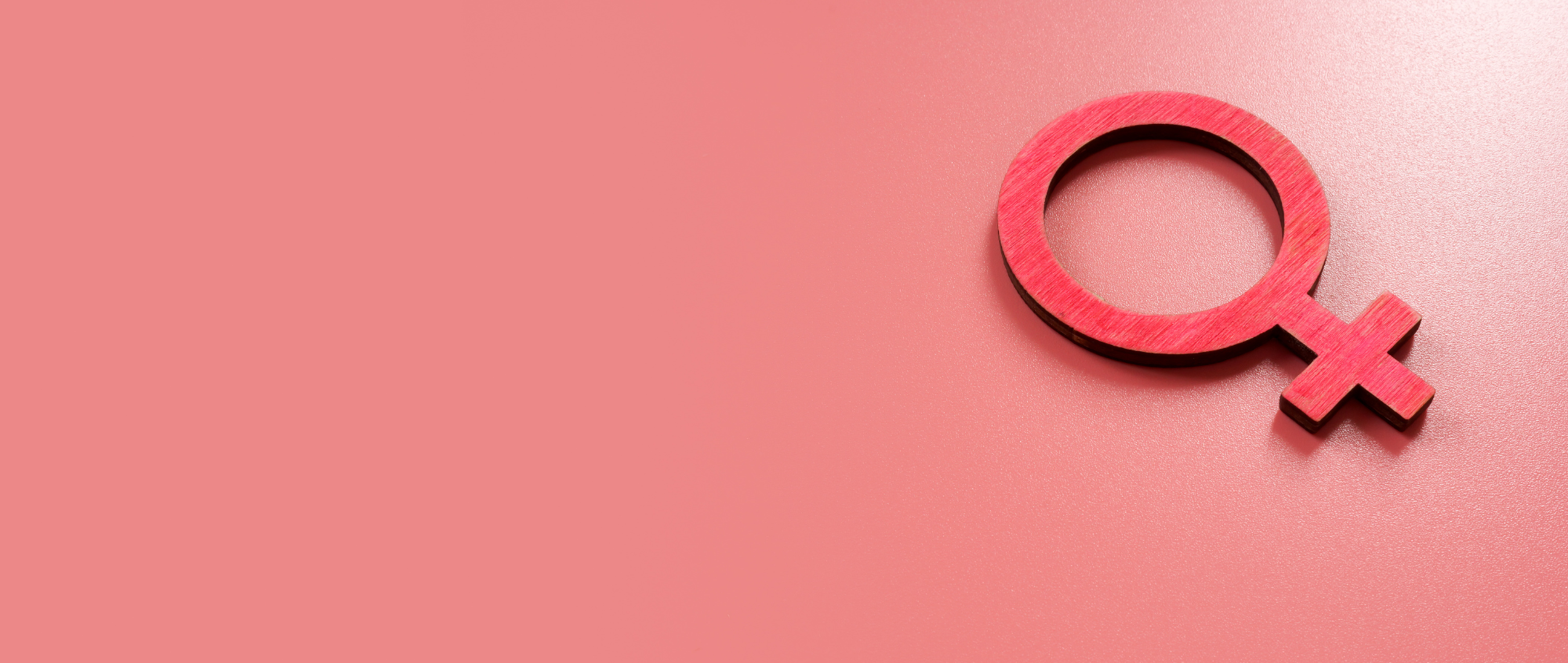Female symbol on pink background