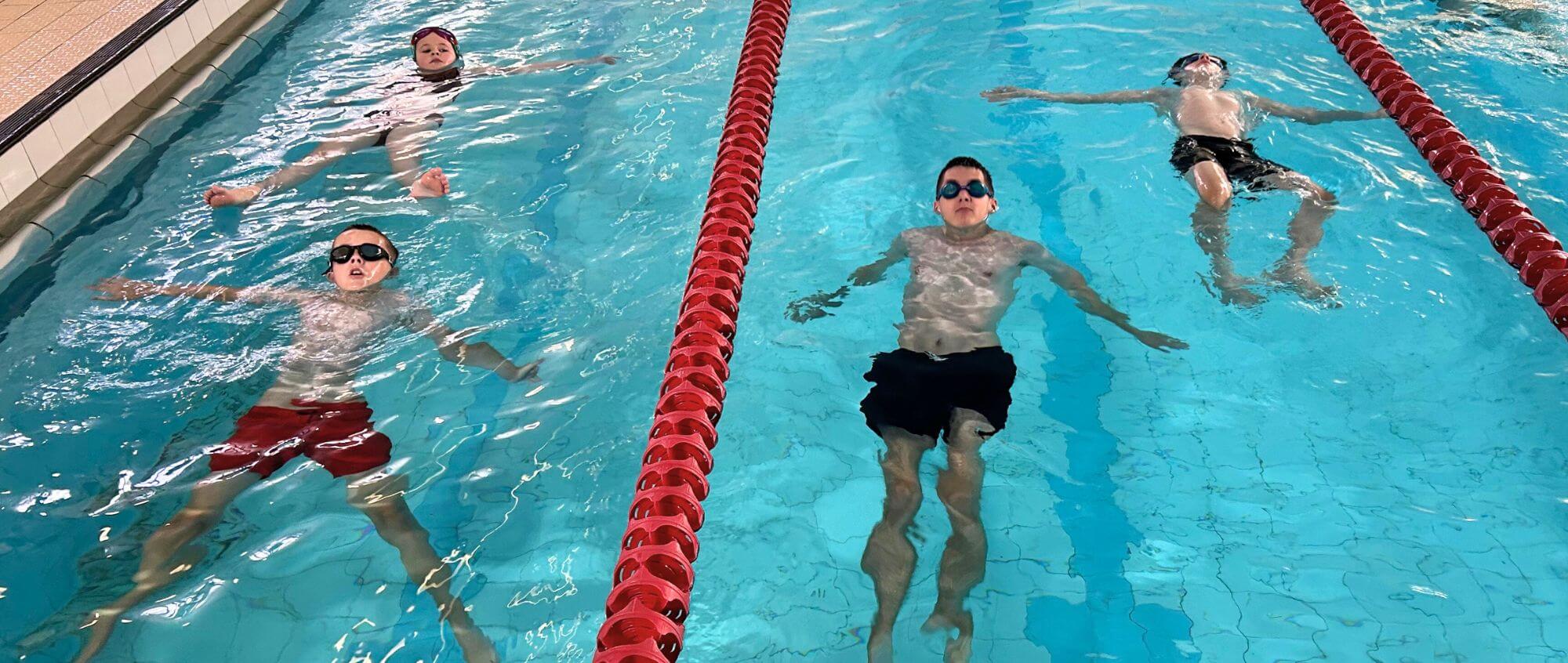 children from the Starfish swim programme in the water at Worsley Pool