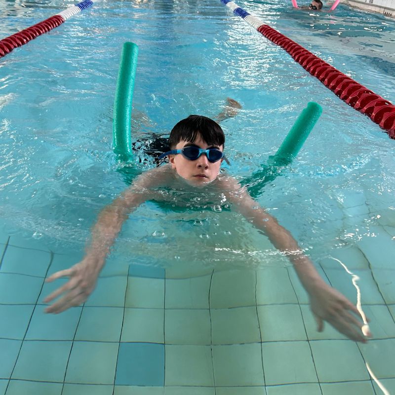 Harry participates in a Starfish swimming lesson
