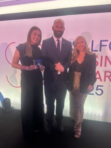 Olivia and Mia with the award and the Salford Mayor