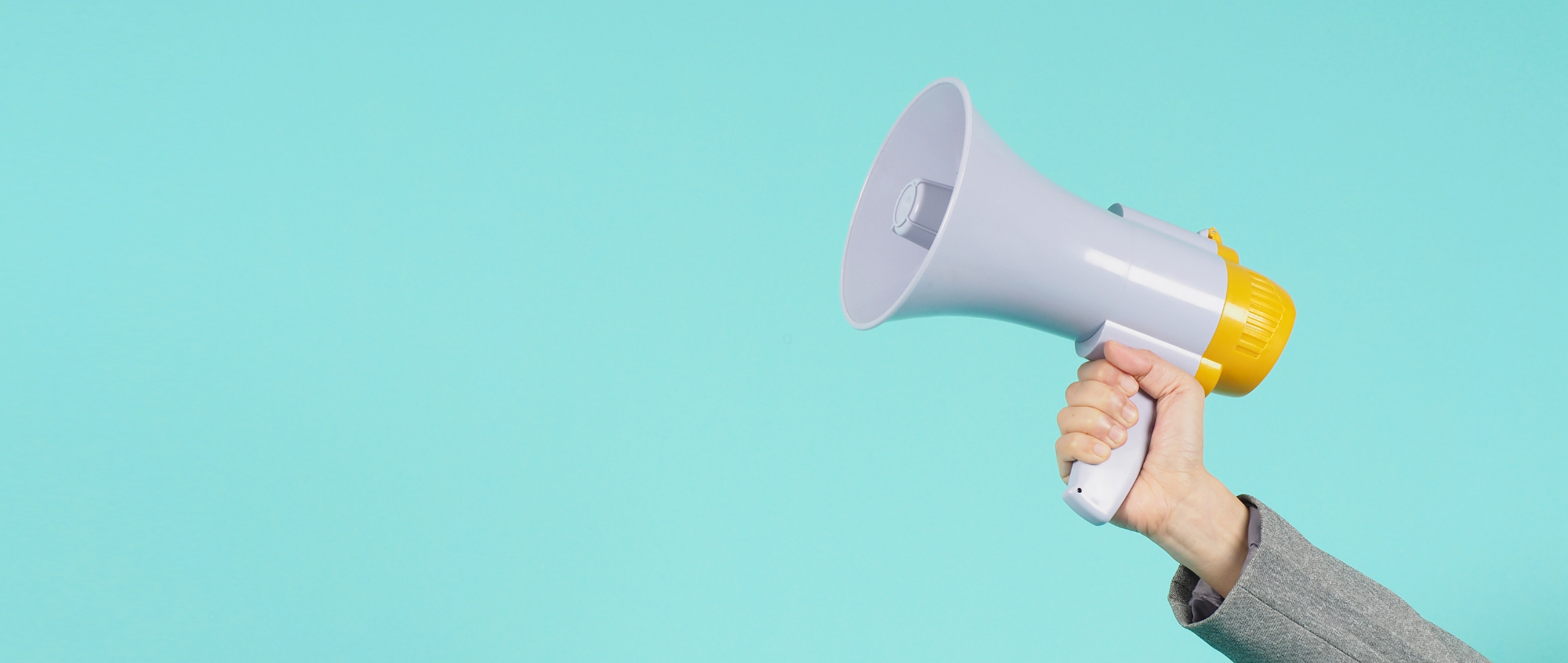 Hand holding megaphone