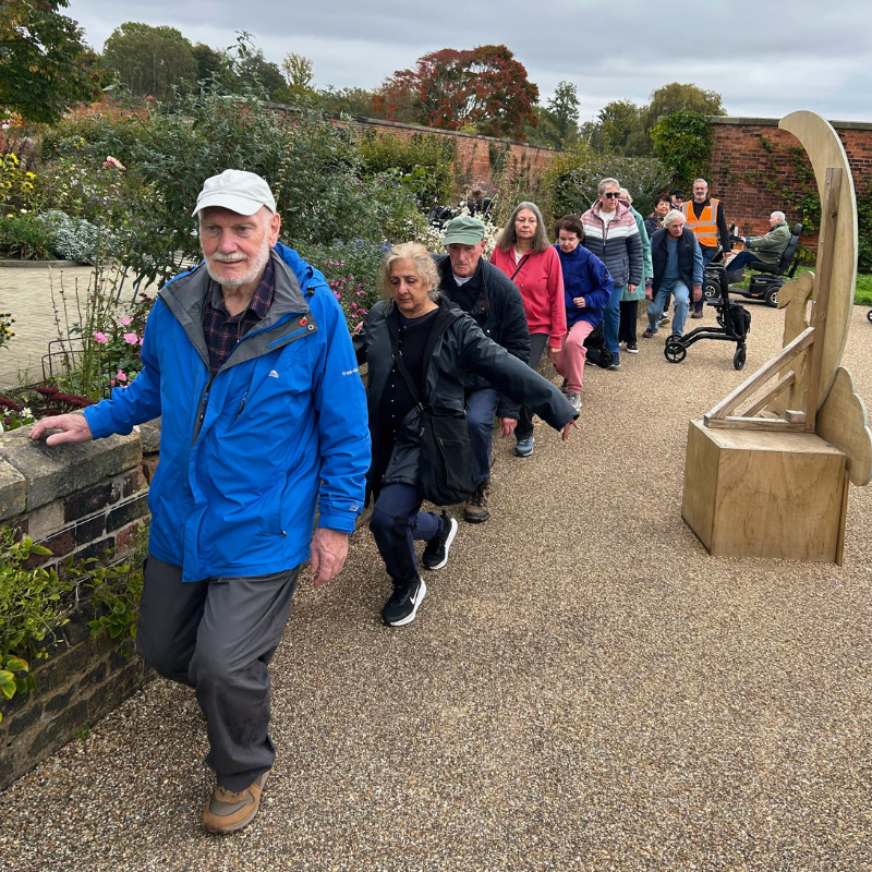 Participants doing strength exercises on RHS wellbeing walk