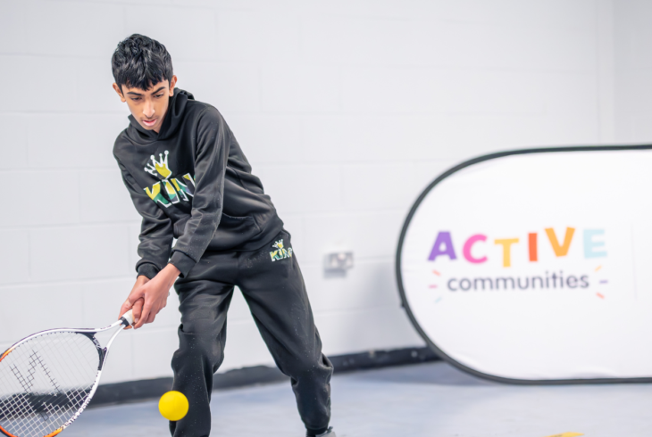 Young boy playing tennis