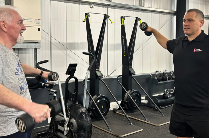 Gareth and Kevin in the gym doing weights
