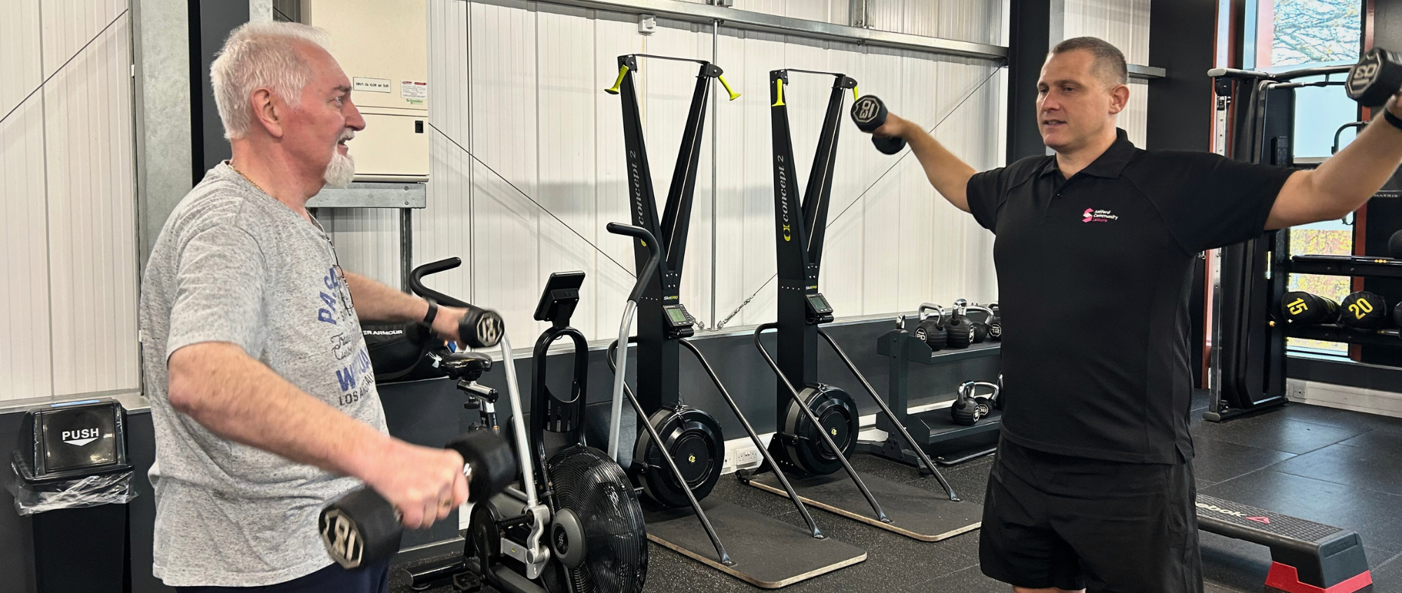 Gareth and Kevin in the gym doing weights