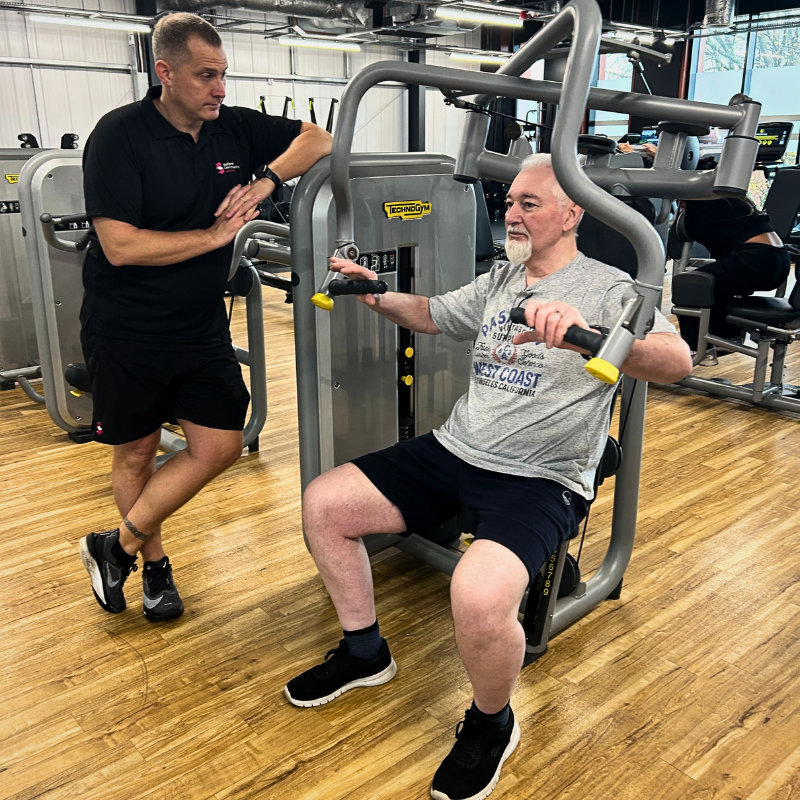 Kevin and Gareth doing weights in the gym