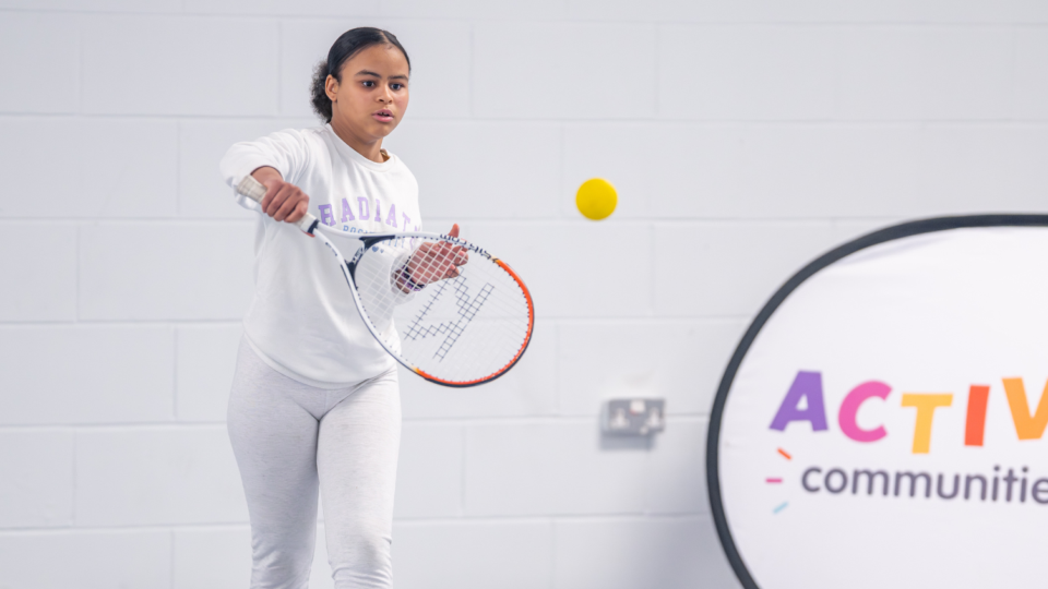 A girl playing tennis at SCL's new free tennis sessions