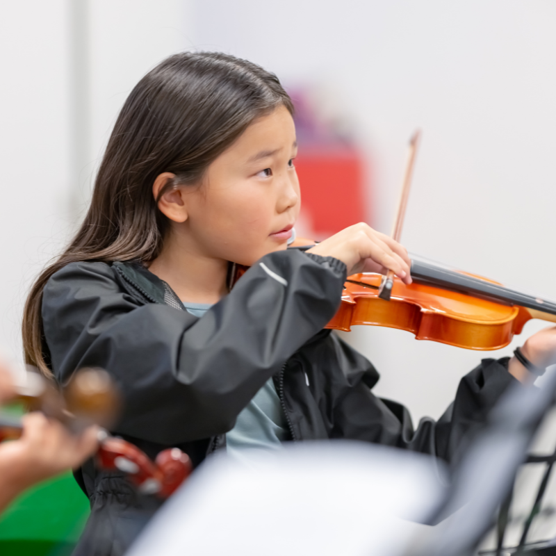 Child playing a violin