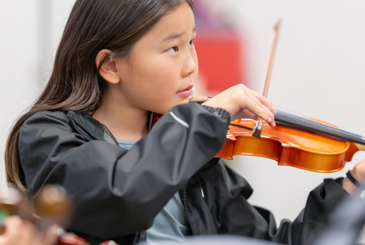 Child playing a violin