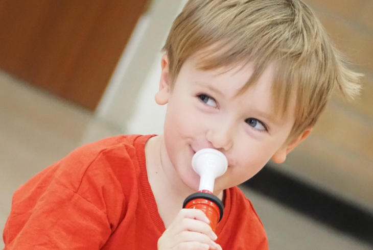 Child playing instrument