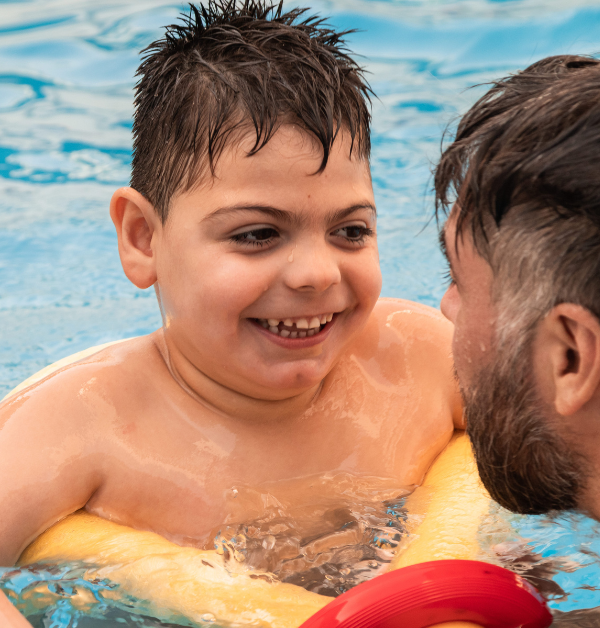 Man with child in pool