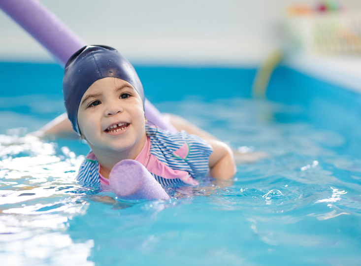 Child with float in pool