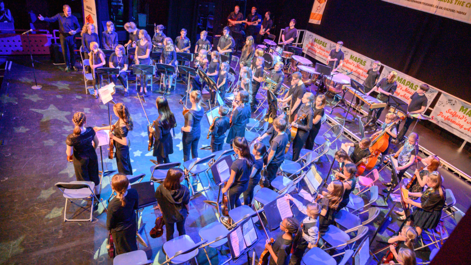 MAPAS orchestra performing at the showcase
