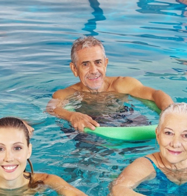 Men and women in swimming pool