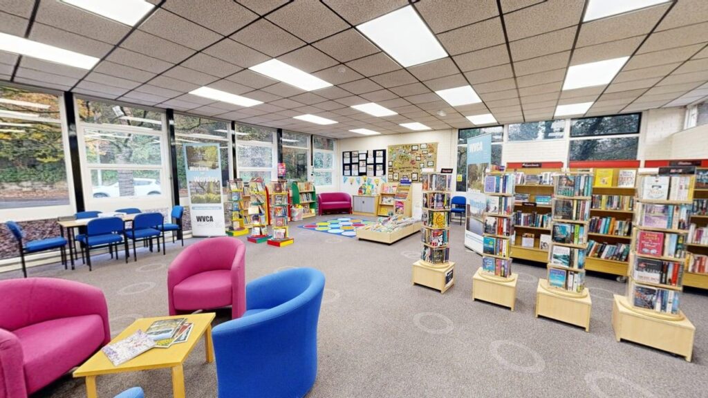 Inside Worsley Village Library with chairs and books