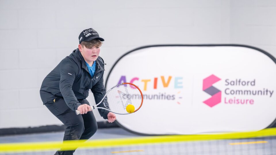Free tennis programme: a boy plays tennis