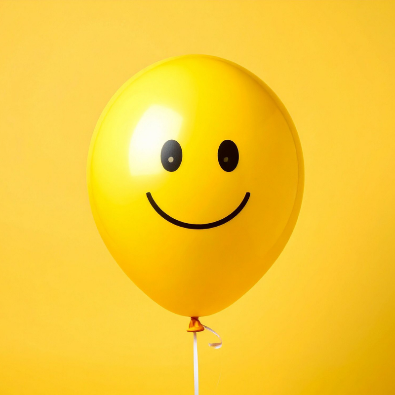 Yellow balloon with smiley face