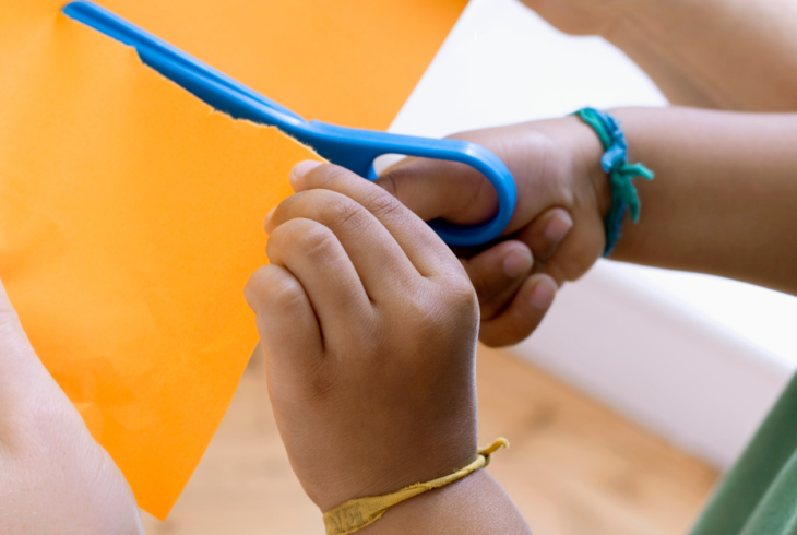 Child cutting paper