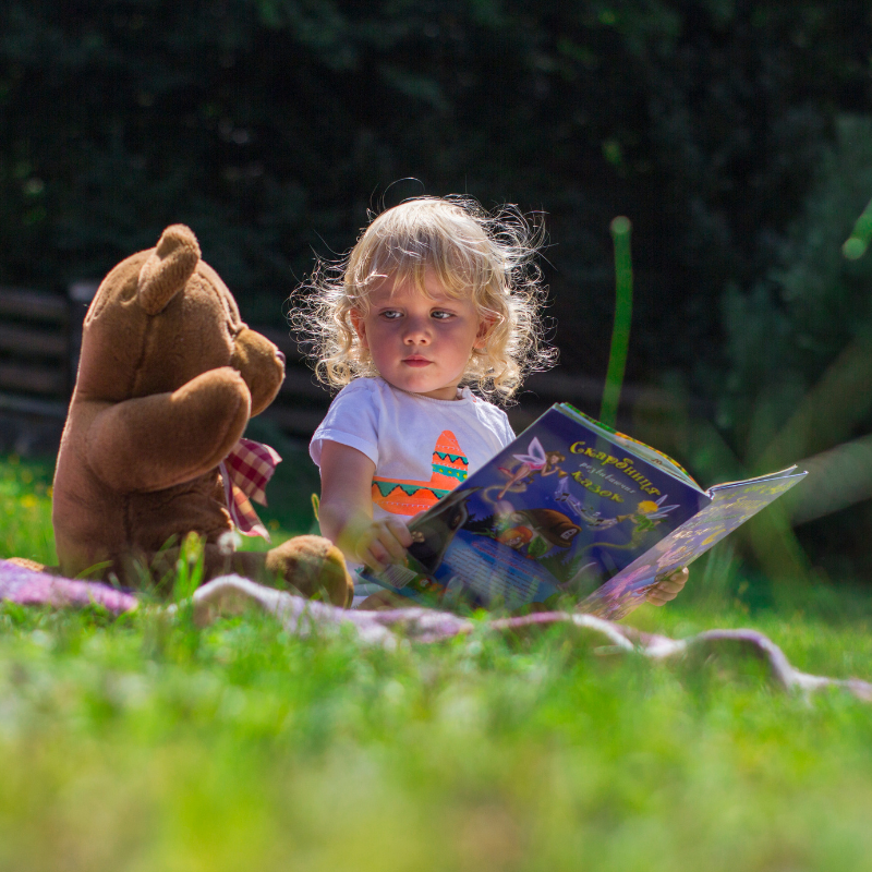 Child sat with teddy bear