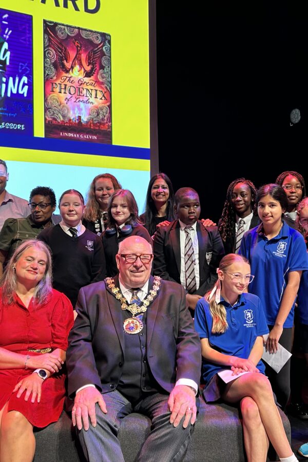 A group picture including the salford ceremonial mayor, authors and school children at the Salford Children's book awards