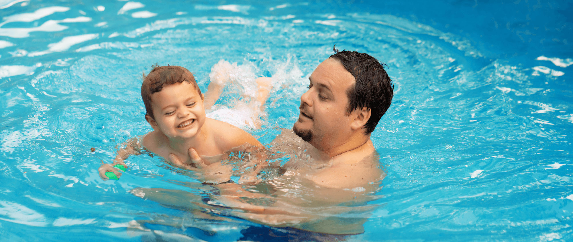 Man and child in pool