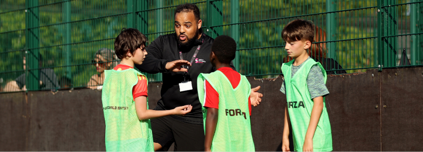 Group of boys with football coach