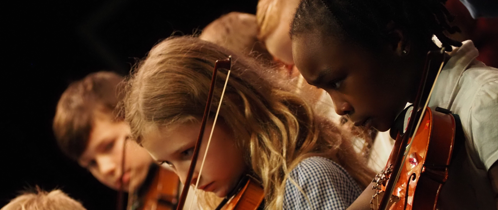 Children Playing the violin at the Lowry Theatre