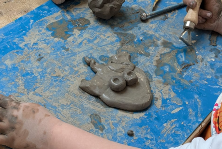Child playing with clay