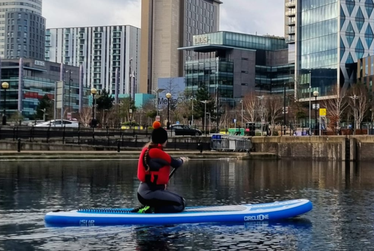 Person paddleboarding