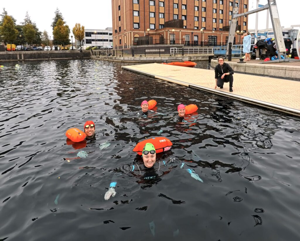 People in water during open water swimming session